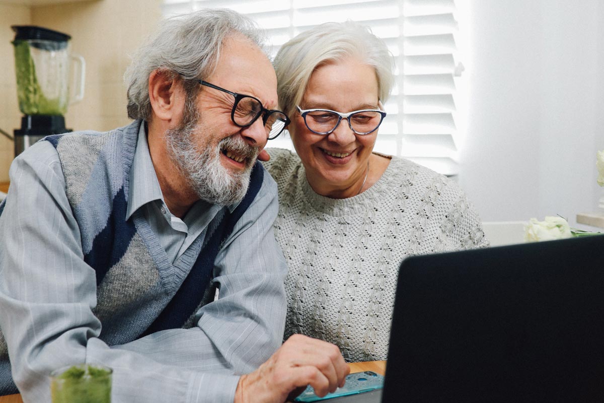 Happy couple viewing computer 